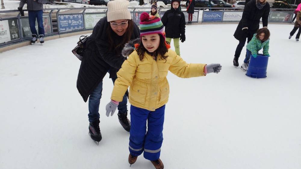 Sitora, skating with her daughter, Munisa in Milwaukee, Wisconsin.